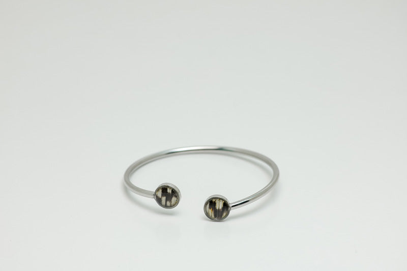 A Double Silver Pendant on a white background.