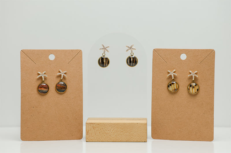 Three  Mini Starfish Posts on a white background. Two pairs are on cardboard stands. 