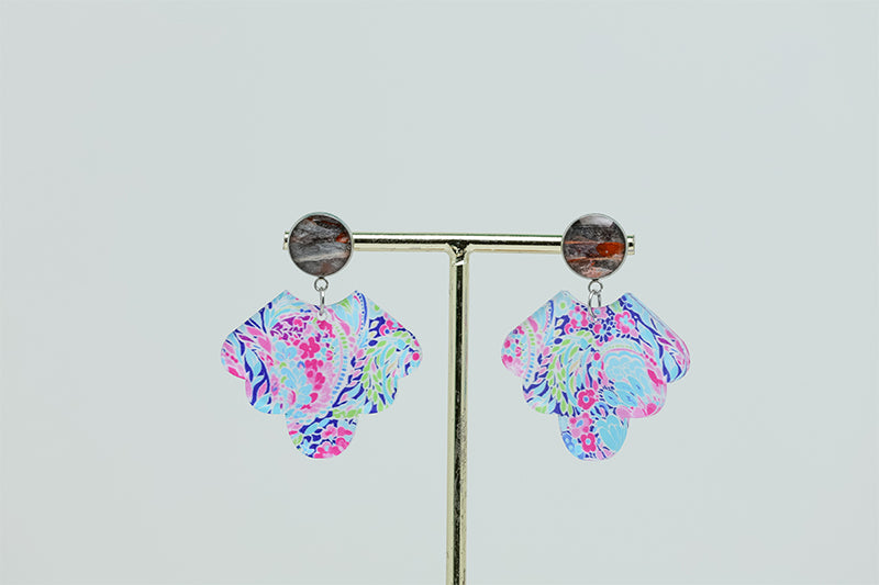 A pair of Preppy Scalloped Earrings on a gold stand on a white background. 