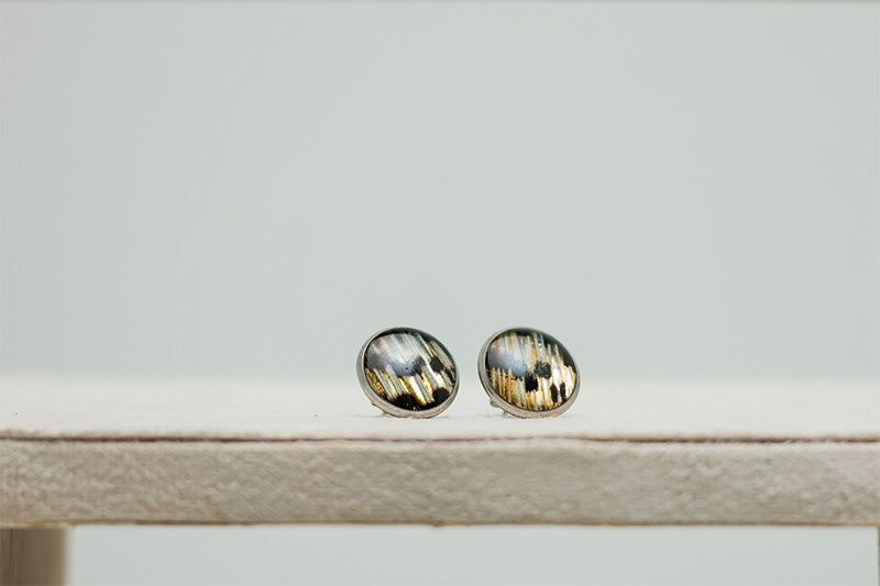 Large Studs on a cream stand on a white background. 